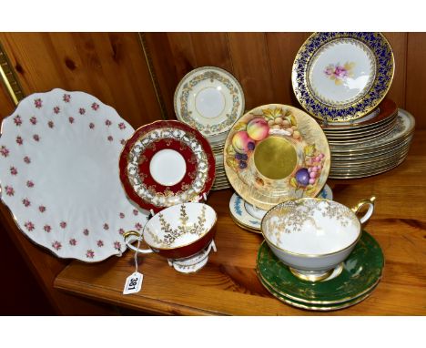 A GROUP OF AYNSLEY TEA AND DINNERWARES, to include a burgundy teacup with raised foot and matching saucer, each having gilt f