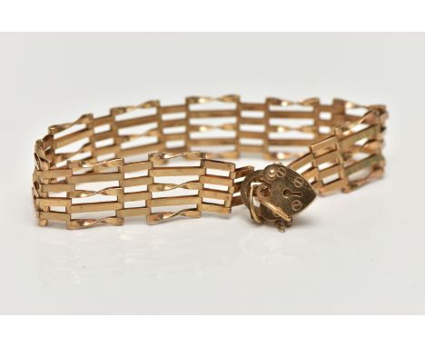 A 9CT GOLD GATE BRACELET, five bar gate bracelet, fitted with a heart padlock clasp and additional safety chain, hallmarked 9