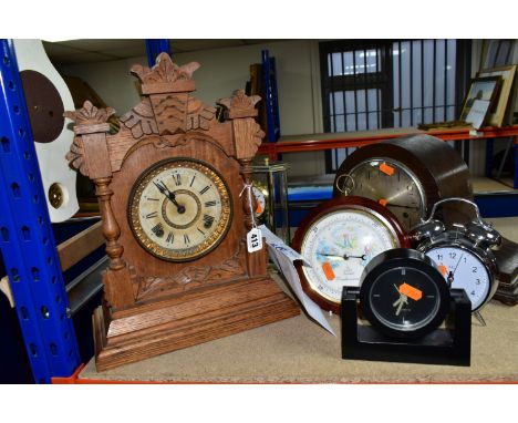 A GROUP OF SEVEN CLOCKS, comprising a chrome alarm clock, quartz black mantel clock, a wooden 'Haller' mantel clock, an early