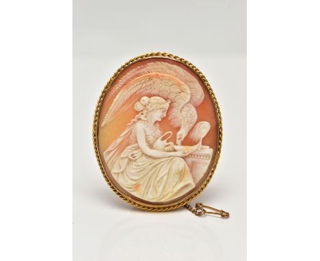 A YELLOW METAL CAMEO BROOCH, of an oval form, carved shell cameo depicting Hebe and Zeus in eagle form drinking from a dish, 