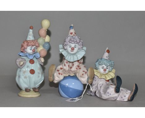 THREE LLADRO CLOWNS, comprising 'Littlest Clown' 5811, 'Having a Ball' 5813, 'Tired Friend' 5812, designed by Antonio Ramos 1