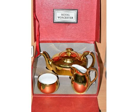 A BOXED ROYAL WORCESTER GOLD LUSTRE THREE PIECE TEA SET, teapot shape 5, size 4, milk jug and sugar bowl (3) (Condition Repor