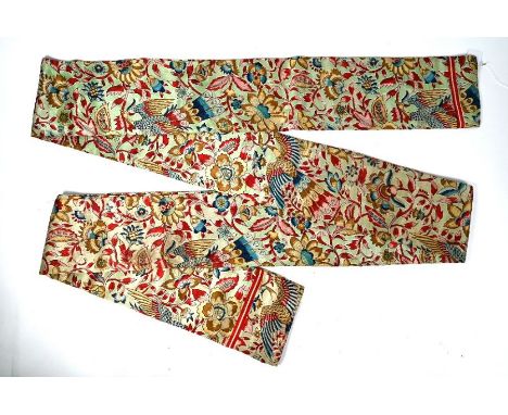 A long silk Obi, the printed decoration of phoenix amongst an abundance of flowering peonies in jewel colourways on jade gree