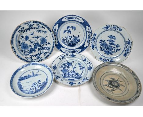 Two 18th century Chinese blue and white plates painted in underglaze blue with similar designs of blossoming peony in fenced 