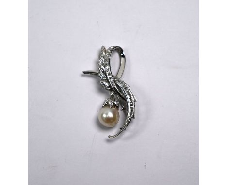 A diamond set brooch, the stylised leaves set overall with mixed cut diamonds, with pearl drop below, approx 5 cm wide, white