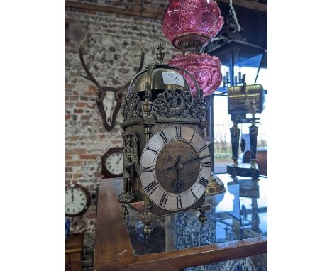 A 17th century style brass lantern clock (mantel clock), the 8-day Astral brand movement with silvered dial engraved 'William