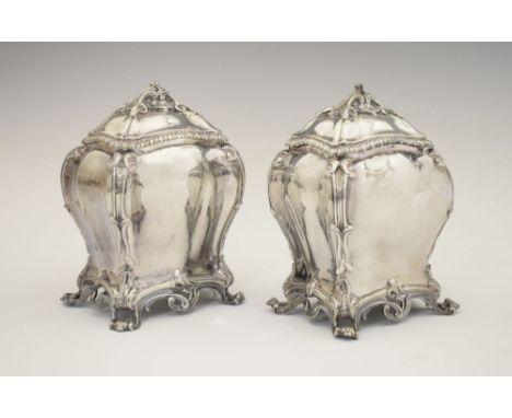 Pair of early George III silver tea caddies, of bombe form on four scroll feet with domed covers, sponsors mark of John Langf