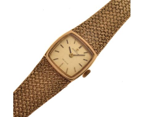 Omega De Ville - Lady's 9ct gold mechanical bracelet watch, the cushion shaped signed gilt dial with gilt black batons and ha