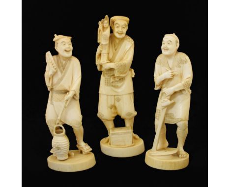 Three early 20th Century Japanese ivory okimono, late Meiji, modelled as a puppeteer, water-carrier and wood cutter with pipe