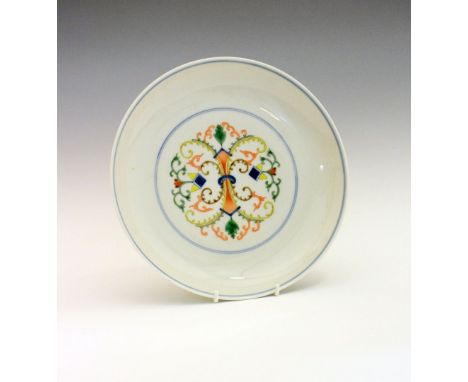 Chinese Ducai porcelain saucer dish, decorated with foliate scroll work in green, blue, orange and yellow, within underglaze 