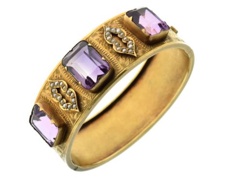 Late 19th Century hinged bangle, unmarked gold, the three rectangular cut stones with seed pearl set motifs between and with 