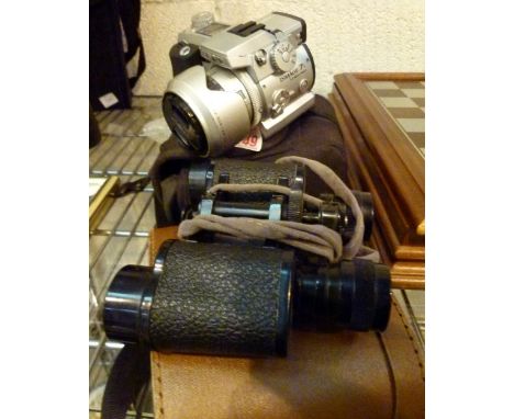 Minolta Dimage 71 digital camera and a cased pair of binoculars 