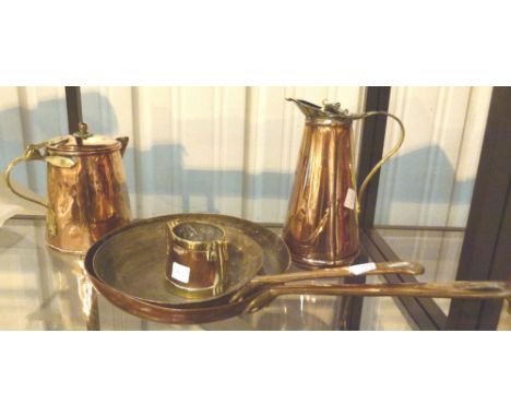 Shelf of copper and brassware 