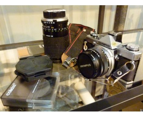 Olympus OM-1 film camera with associated lenses and filters 