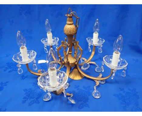 A FIVE-BRANCH CHANDELIER with glass drops