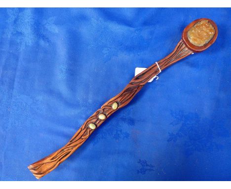 A RUYI SCEPTRE, WOOD WITH 'JADE' INSET and cabochons mounted on the shaft 48cm long