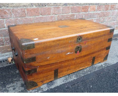 A CAMPHORWOOD AND BRASS-BOUND TRAVELLING TRUNK of small proportions, late 19th century 73 x 40cm (some cracks)