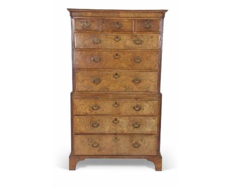 Georgian walnut veneered chest on chest with moulded cornice over three short and six long drawers raised with central pull-o