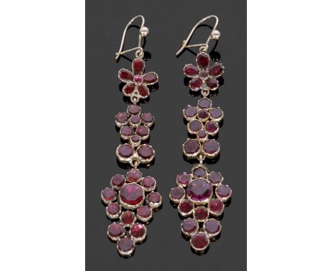 Pair of vintage Bohemian style garnet pendant earrings of floral cluster design with enclosed settings and shepherd hook fitt