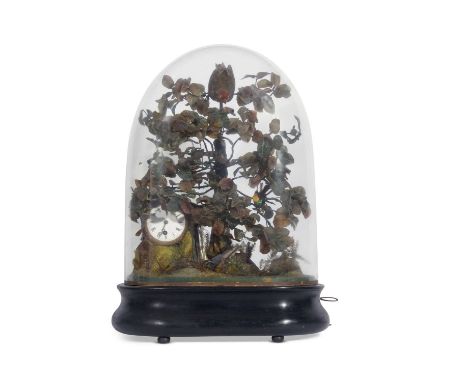 A fine and unusual 19th century French automaton bird clock with taxidermy bird, displayed on simulated branches, the clock f