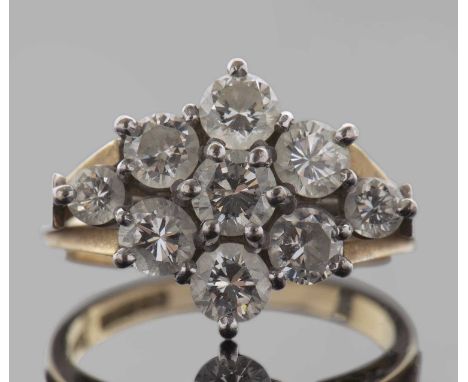 18ct gold diamond cluster ring, a flowerhead design featuring seven round brilliant cut diamonds with two small diamond highl