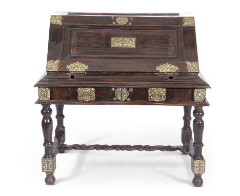 Large 19th century Ceylonese trunk on stand, top section with fall down front containing 8 small drawers, standing on a two-d