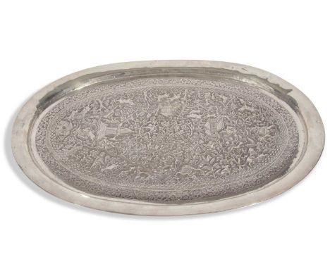 Large late 19th/early 20th-century Indian white metal oval tray, heavily chased and embossed to the centre with hunting scene