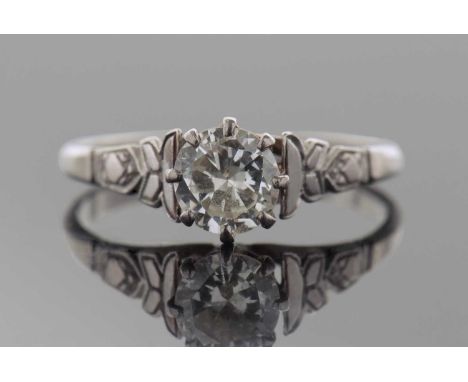 Precious metal single stone diamond ring, the round brilliant cut diamond 0.50ct approx, raised between chased shoulders