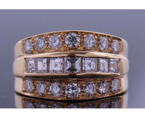 High grade yellow metal diamond cluster ring featuring a central row of square cut pave set diamonds raised between two bands