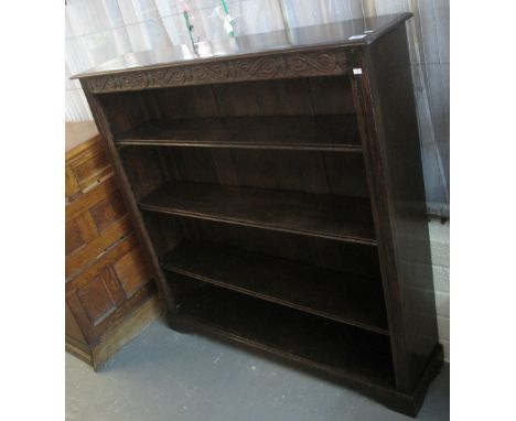 Early 20th Century good quality oak four section open bookcase with carved decoration on bracket feet. (B.P. 24% incl. VAT)