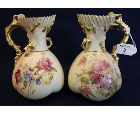 Two similar Royal Worcester porcelain blush ivory baluster shaped jugs with crab stock mounts and handles and fluted necks, o