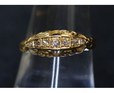 An 18ct gold five stone diamond ring. 3g approx. (B.P. 24% incl. VAT)