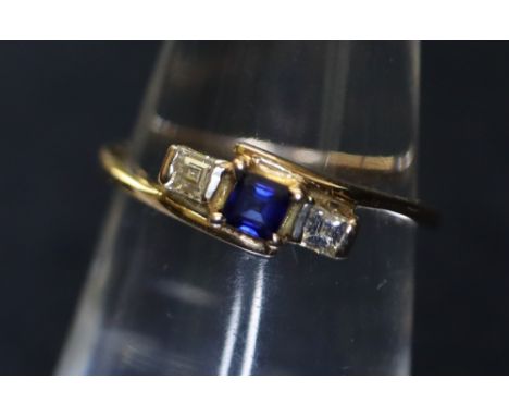 A sapphire and diamond square cut stone ring on 14ct gold twist shank. 1.6g approx. (B.P. 24% incl. VAT) CONDITION REPORT: Ri