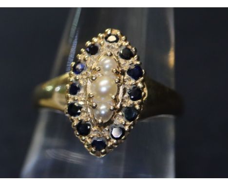 A yellow metal ring set with pearls and sapphires, 4.1g approx. (B.P. 24% incl. VAT)
