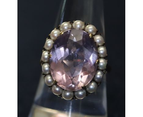 A 9ct gold pearl and amethyst dress ring. 6.1g approx. (B.P. 24% incl. VAT)