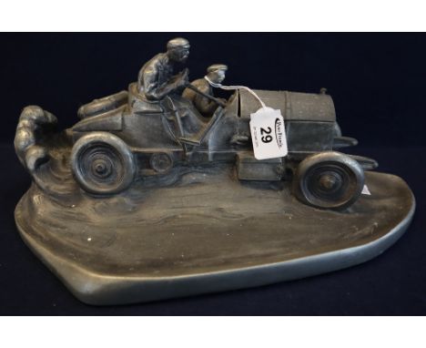 Large white metal ink stand modeled in the form of an early Gordon Bennett type racing car. Hinged bonnet reveals recess for 