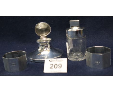 Silver topped straight sided glass scent bottle with silver stopper, pair of silver engine turned octagonal napkin rings and 