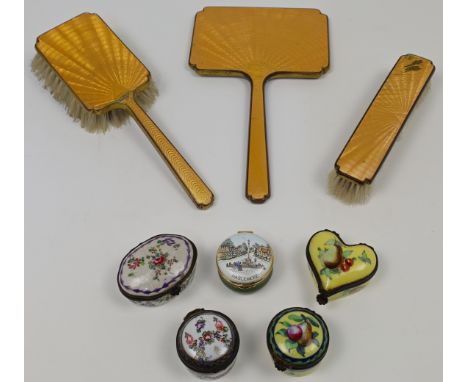 A group of French porcelain and enamel pill boxes, 19th century, to include a shaped oval box and a circular box, each with m