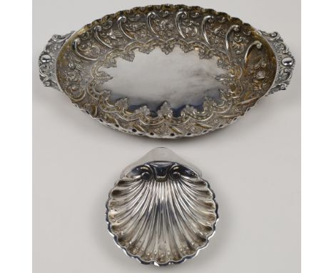 A Victorian silver dish, London, 1886, Charles Edwards, of oval form with scalloped rim and scrolling foliate handles, the in