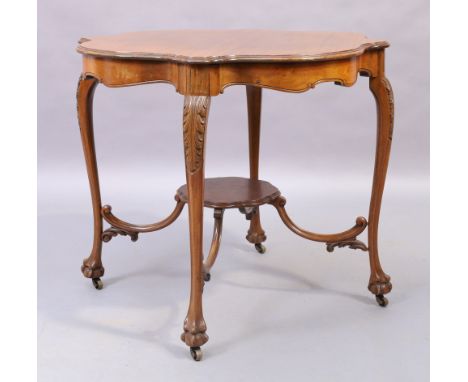 A French mahogany occasional table, early 20th century, the shaped top raised on cabriole legs to ball and claw feet and cast