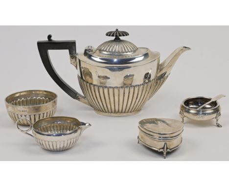 A group of silver, comprising: a Victorian teapot, Sheffield, 1898 Roberts &amp; Belk, with gadrooned body and ebonised handl