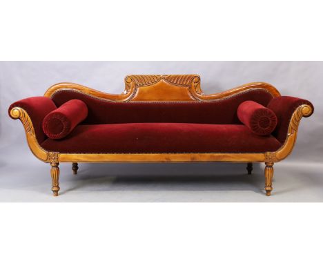 A William IV style mahogany scroll end sofa, early 20th century, with burgundy velour upholstery, raised on fluted legs, 92cm