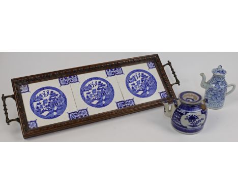 Two pieces of Chinese provincial blue and white porcelain, 19th century, comprising: an oil pot and cover decorated with lotu