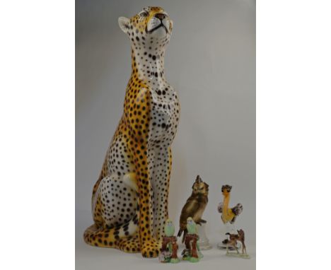 A group of ceramic and glass animalia, 20th century, to include a Continental porcelain model of a bird of prey, a Russian gl
