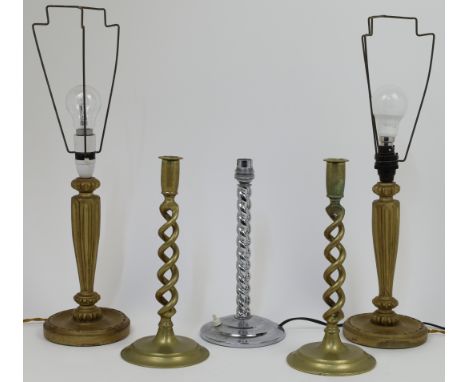 A group of lighting and candlesticks, to include a pair of barley twist brass candlesticks, 30cm high, a pair of giltwood pan