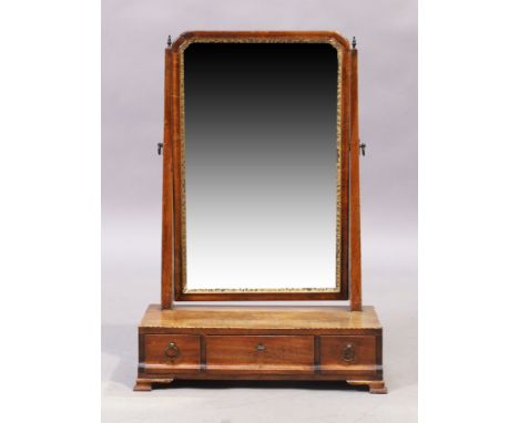 A George III mahogany dressing mirror, last quarter 18th century, the swing mirror above three drawers, raised on bracket fee