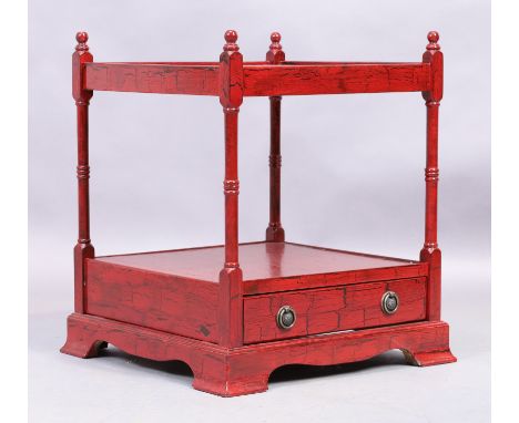 A modern red painted two tier whatnot, in the Regency taste, with single drawer, raised on bracket feet, 57cm high, 45cm wide