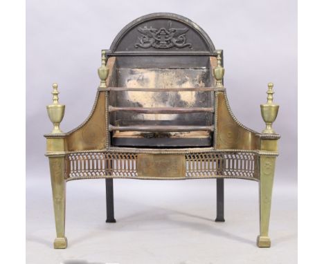 A George III style brass and steel fire grate, last quarter 19th century,&nbsp;with cast iron back plate with two angels, urn