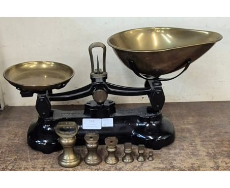 A set of Libra scales and graduated brass weights 