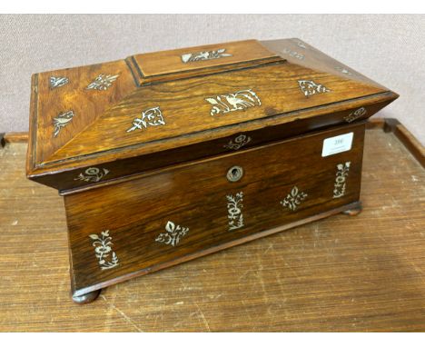 A Regency rosewood and mother of pearl inlaid sarcophagus shaped tea caddy 